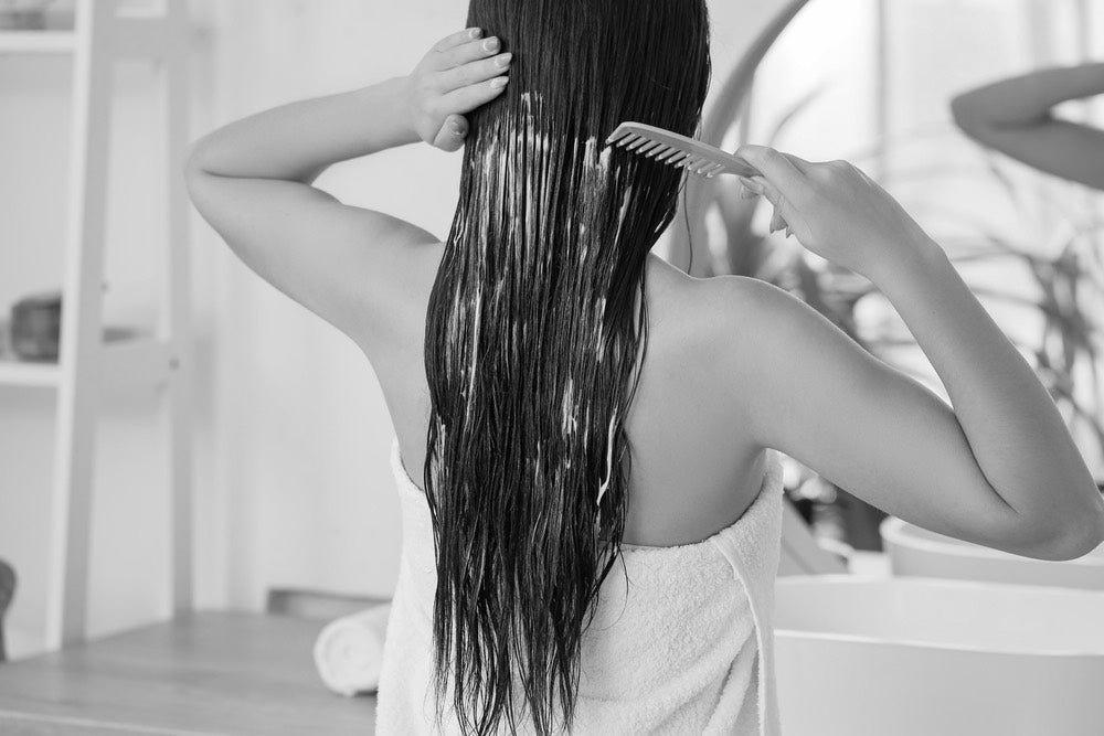 Women Applying Conditioner to Hair