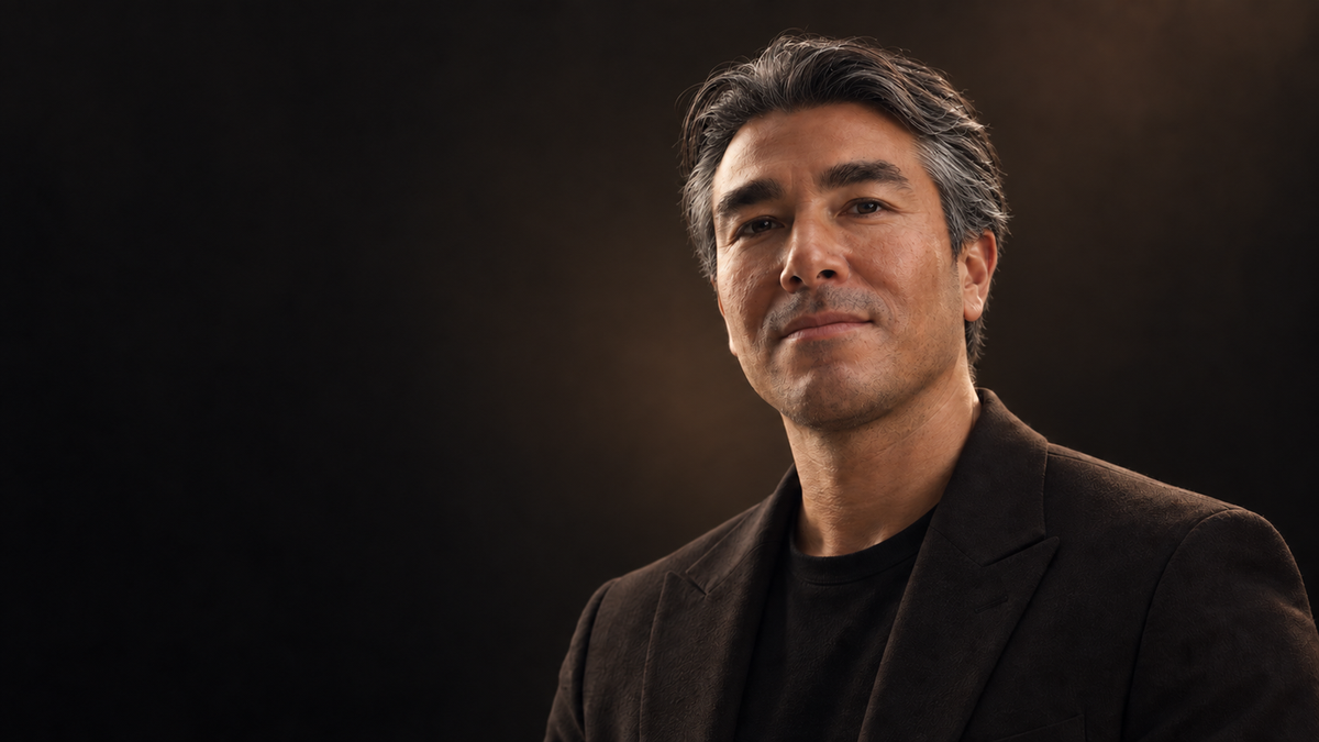 Man with naturally dark and silver hair illustrating visible hair greying