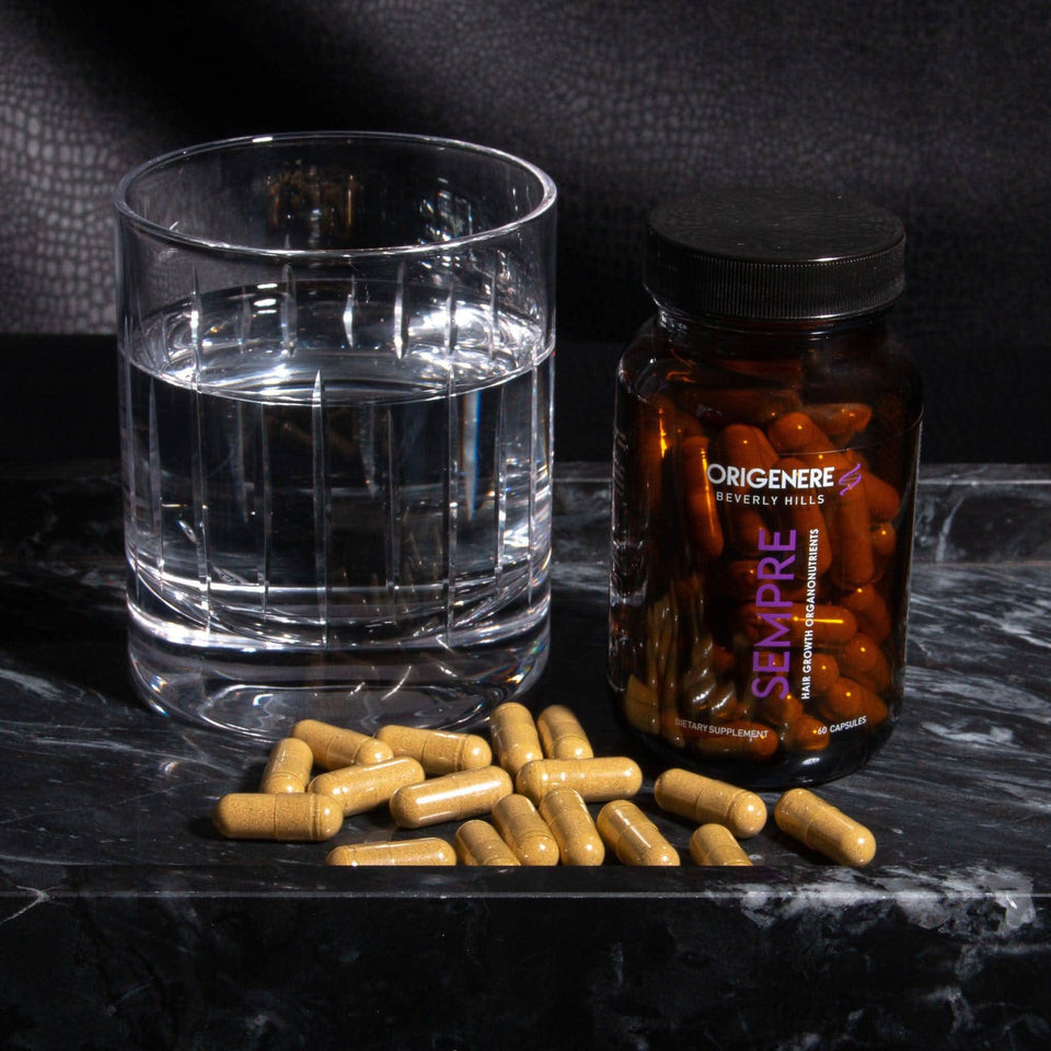 Sempre Hair Growth Organonutrients bottle, capsules, and a glass of water