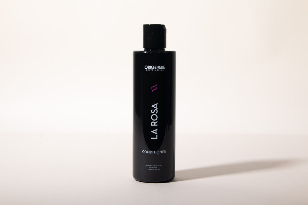 Black bottle of 'La Rosa' conditioner on a white background