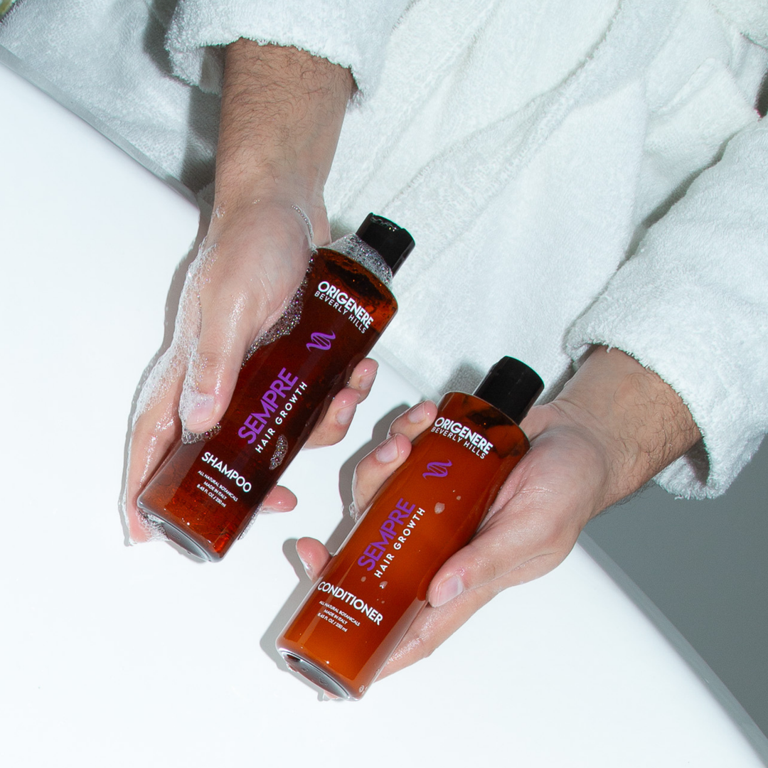 Person holding Sempre Hair Growth Shampoo and Conditioner over bathtub