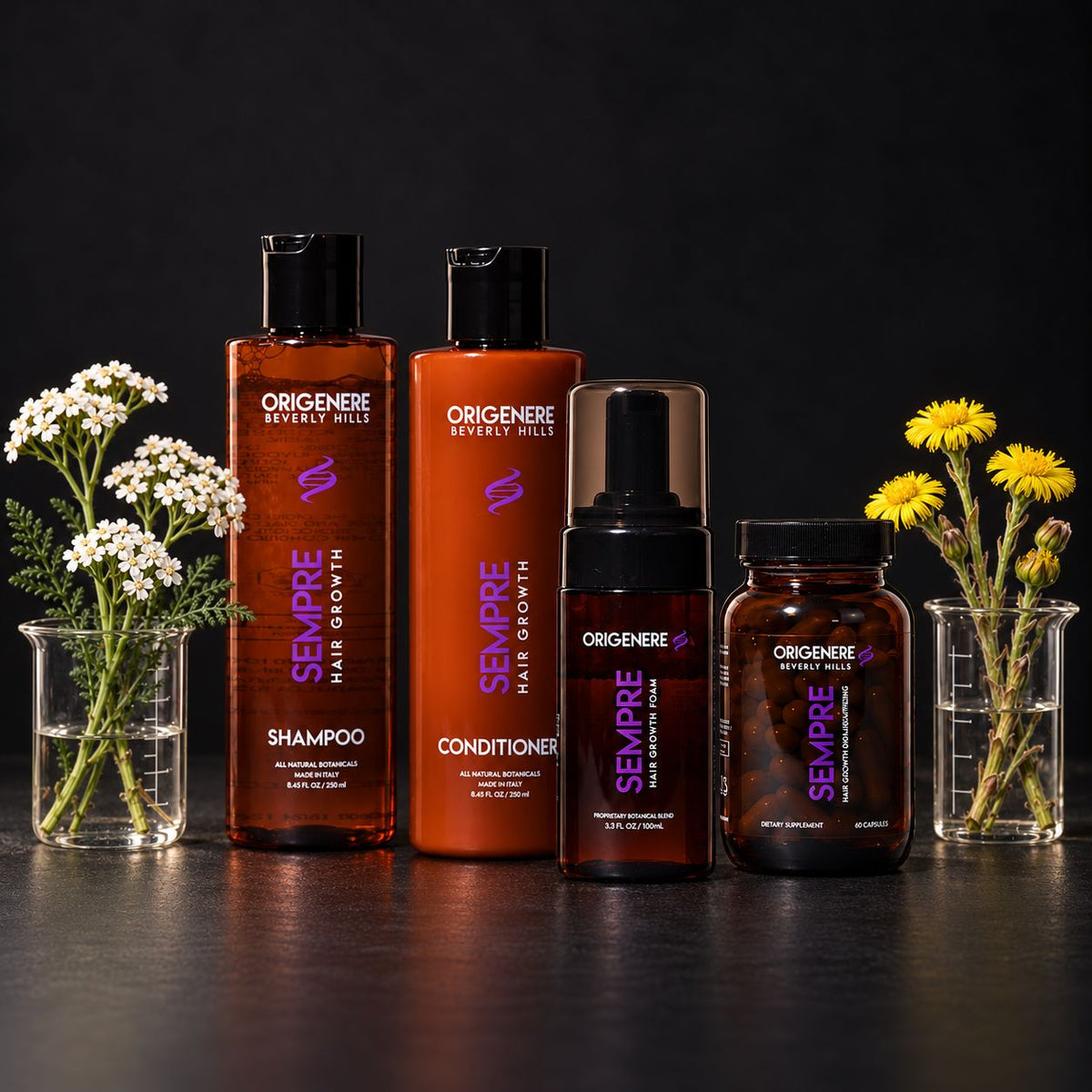 Origenere Sempre hair growth system with shampoo, conditioner, foam and vitamins beside glass beakers of yarrow and coltsfoot flowers.